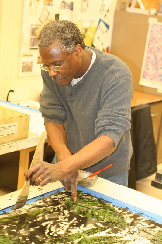 Artist Gregory Page printing at the Normal Editions Workshop in 2013.