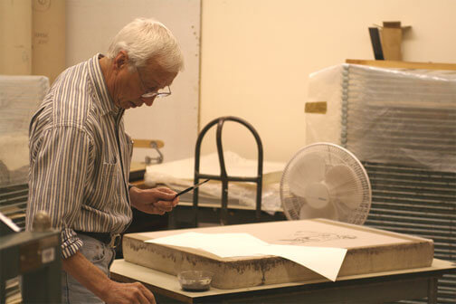 Artist Harold Boyd works on his print at the Normal Editions Workshop in 2005.