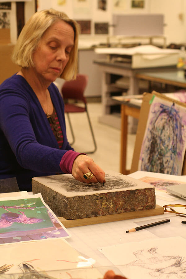 Artist Judy Glantzman works on her print at the 2014 Normal Editions Workshop.