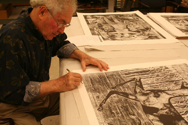 Rudy Pozzatti signing prints at Normal Editions Workshop on April 22, 2010.