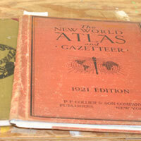 The cover of The New World Atlas and Gazetteer